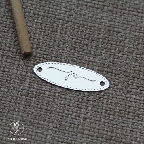 etiqueta de metal oval personalizada